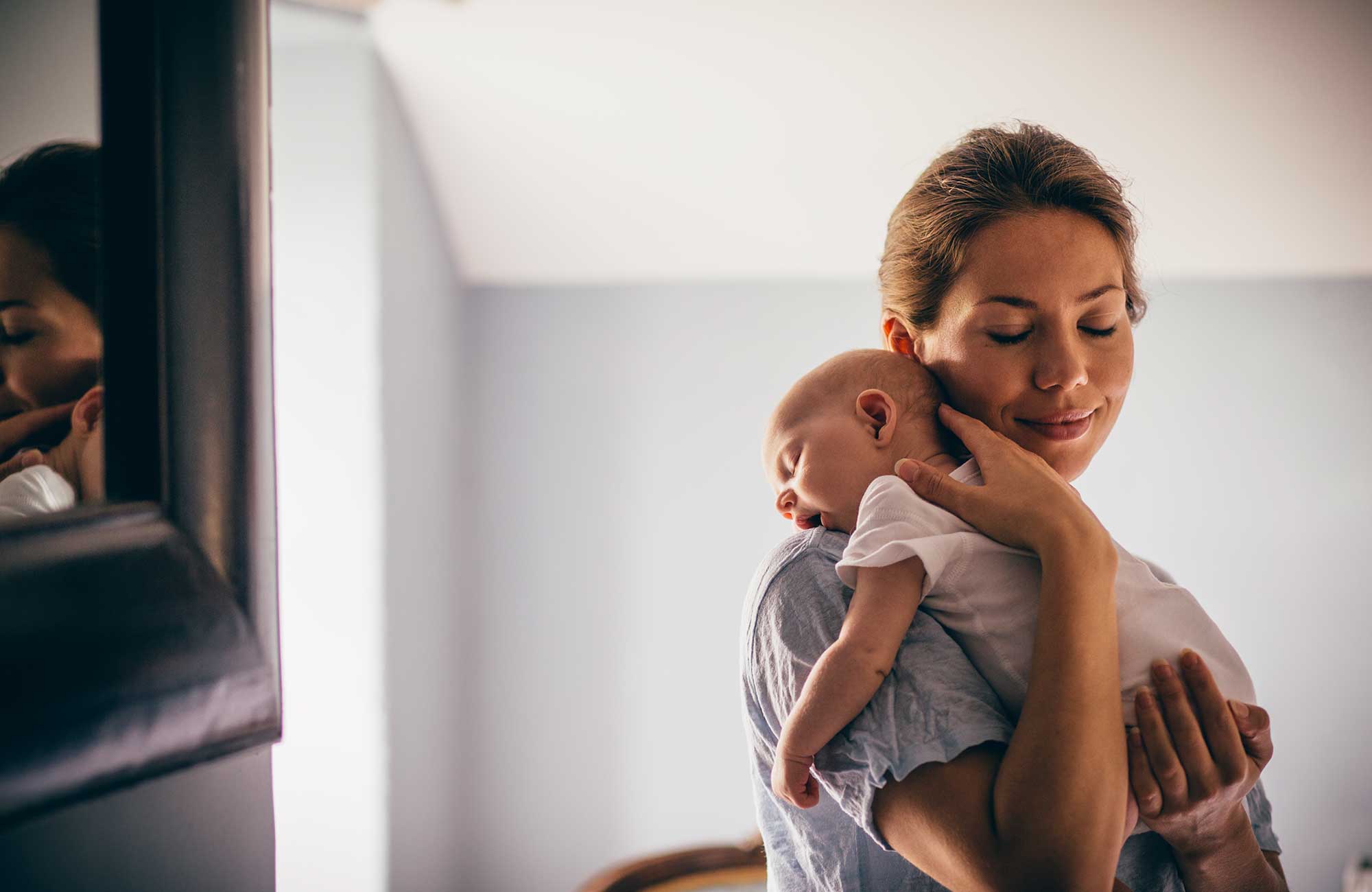 Mother holding her newborn